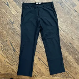 Calvin Klein Men’s Infinite 4-way Stretch Solid Slim-Fit Pants black size 31x32