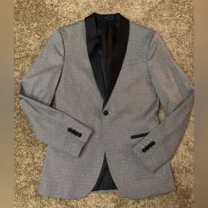 Gray blazer jacket and black dress pants