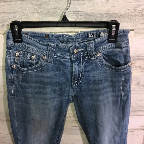 Miss me Womens jeans distressed with horse shoes and cross pockets embellished​​