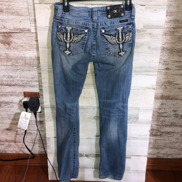 Miss me Womens jeans distressed with horse shoes and cross pockets embellished​​