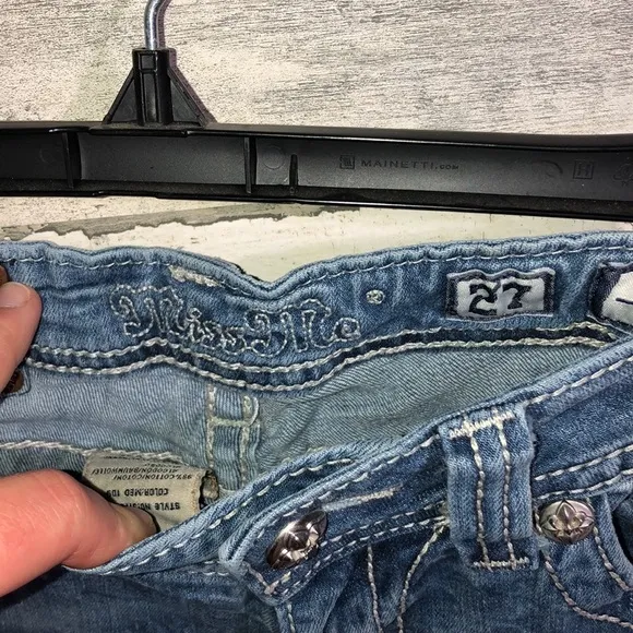 Miss me Womens jeans distressed with horse shoes and cross pockets embellished​​
