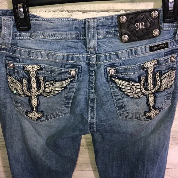 Miss me Womens jeans distressed with horse shoes and cross pockets embellished​​