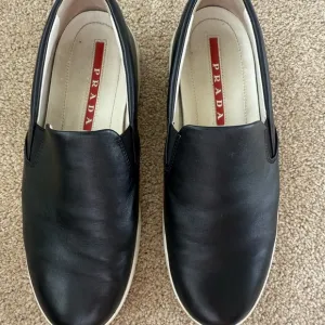 Prada Black Leather Slip-On Shoes