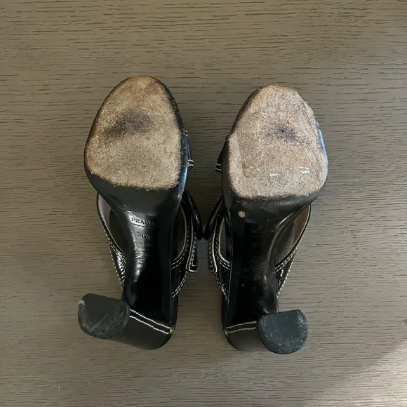 PRADA | Luxury Black Leather White Stitch Criss-Cross Buckle Heel | Size 37.5