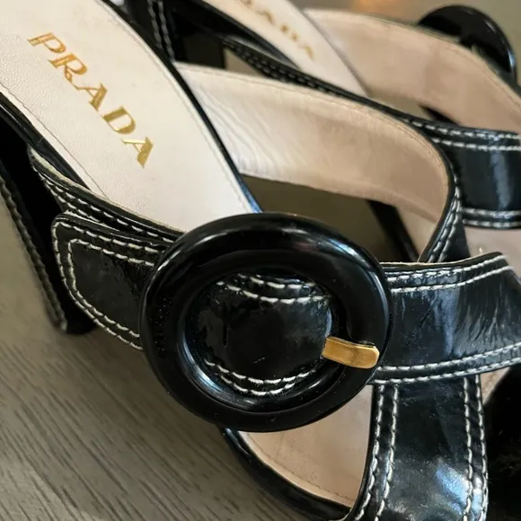 PRADA | Luxury Black Leather White Stitch Criss-Cross Buckle Heel | Size 37.5