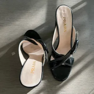 PRADA | Luxury Black Leather White Stitch Criss-Cross Buckle Heel | Size 37.5