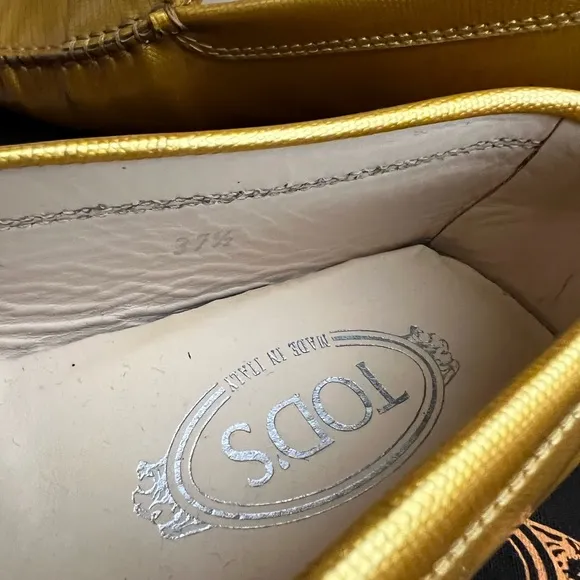 Tod’s Gommino Driving Shoes in Gold Patent Leather. Size 37.5